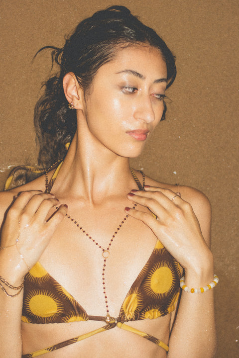 romantic beaded necklace that adds a layer of luxurious mystery to your outfit
